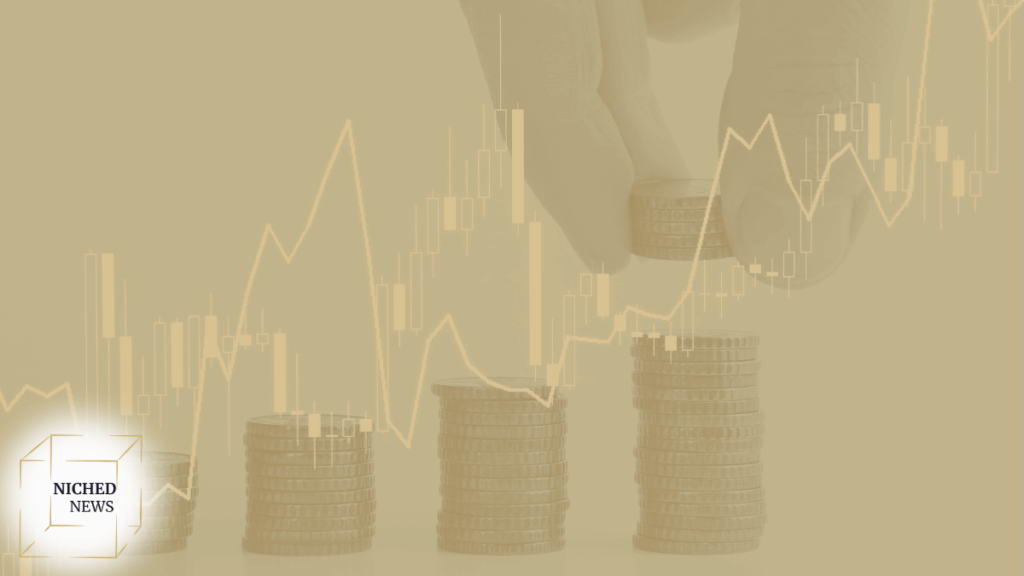 Hand stacking coins with financial chart overlay