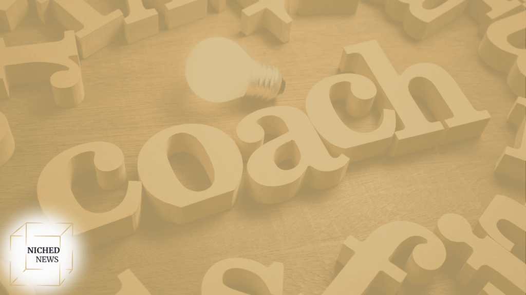 Creative coaching concept with wooden letters and lightbulb for inspiration