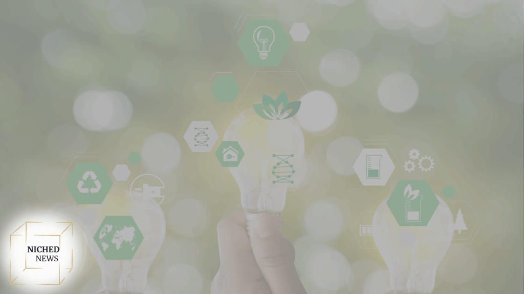 Hand holding glowing lightbulb with eco-friendly icons over nature background